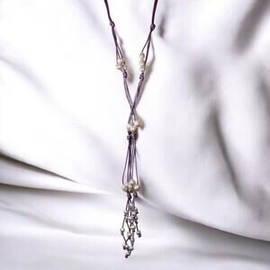 Try something different. 36 Pearls on 3 strands of light lavender long necklace.